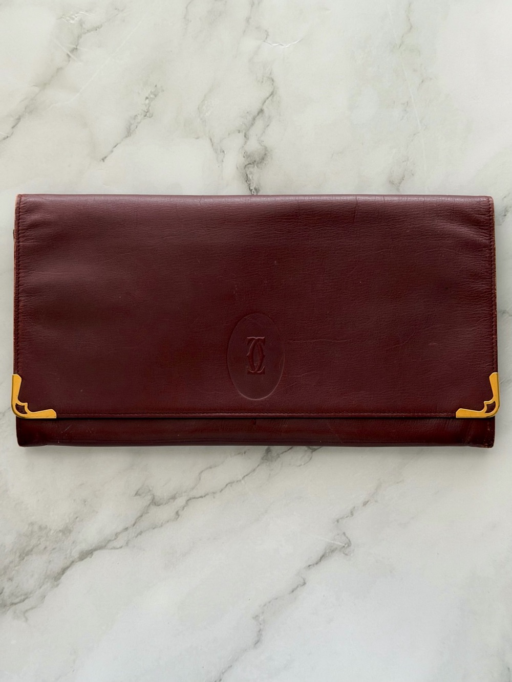 CARTIER PARIS MUST DE Bordeaux
Burgundy Leather Vintage Clutch Purse